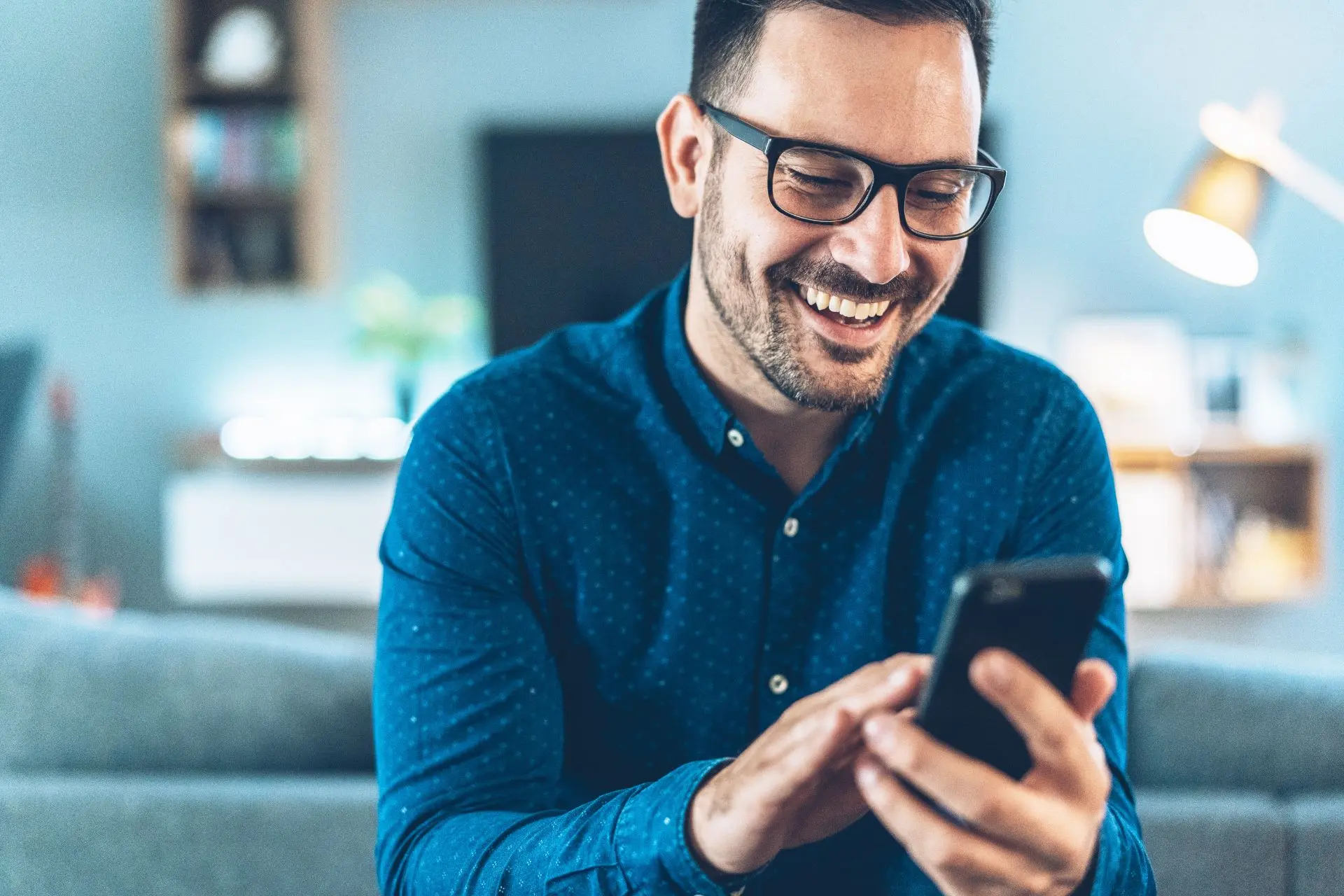 A Similing man on a phone